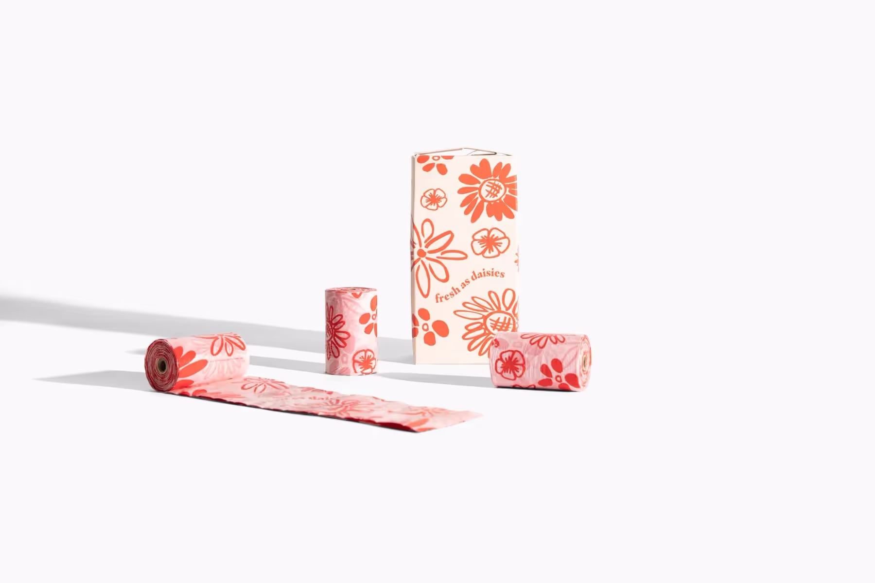 dog poop bags on a white backdrop 